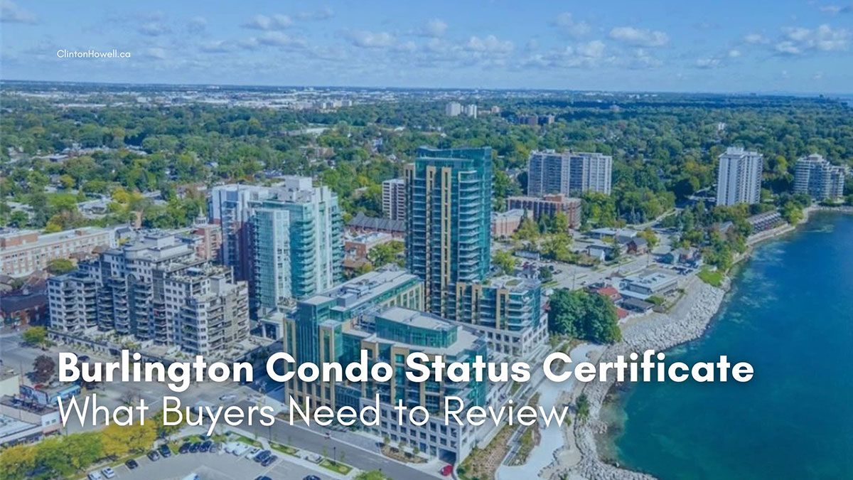 Aerial view of Burlington Ontario waterfront condo buildings along Lake Ontario with downtown skyline and green tree canopy in the background